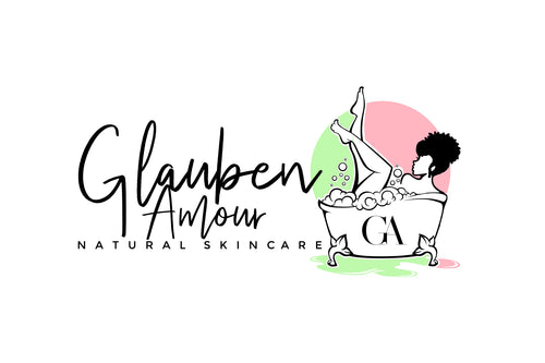 Glauben Amour Logo, Glauben Amour in a swirly font, Natural Skincare in Montserrat font, pale green and light pink accent colors, a cute claw foot tube with a woman relaxing while taking a bubble bath in the tub